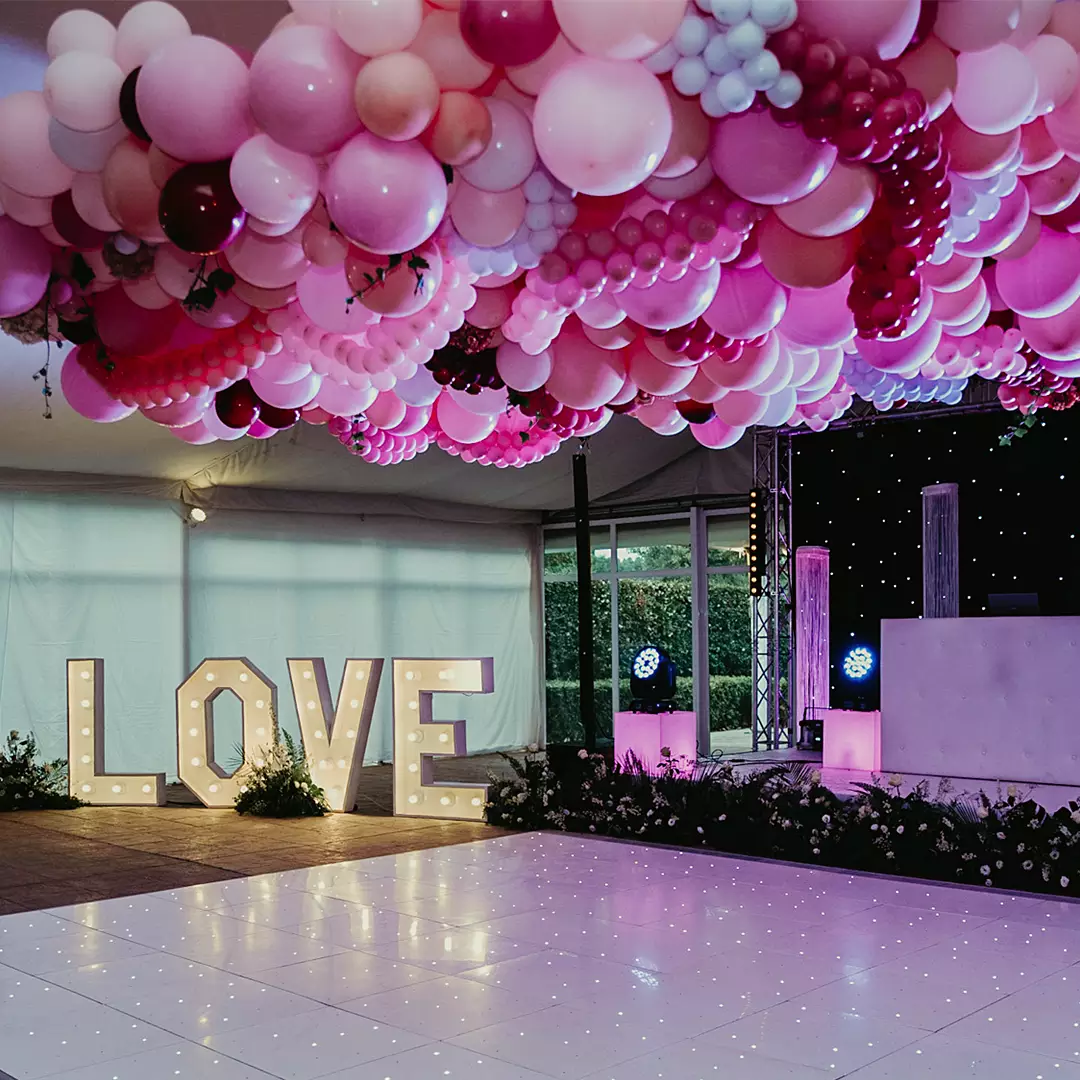 A decorated event space with a lighted 